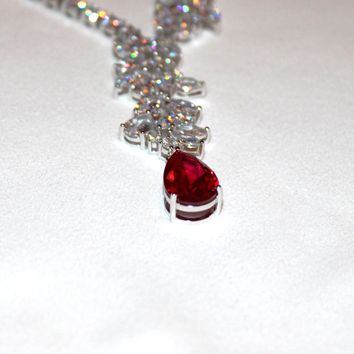 Theresa: Rhodium-plated .925 Sterling Marquise Diamond with teardrop Ruby Earrings