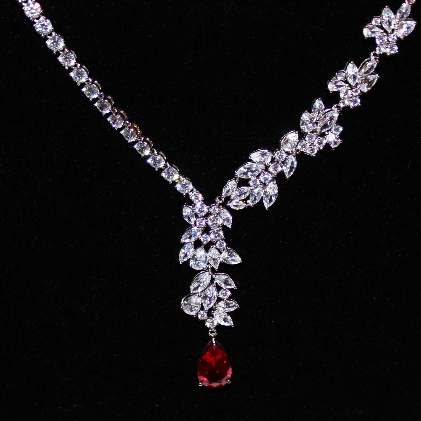 Theresa: Rhodium-plated .925 Sterling Marquise Diamond with teardrop Ruby Earrings