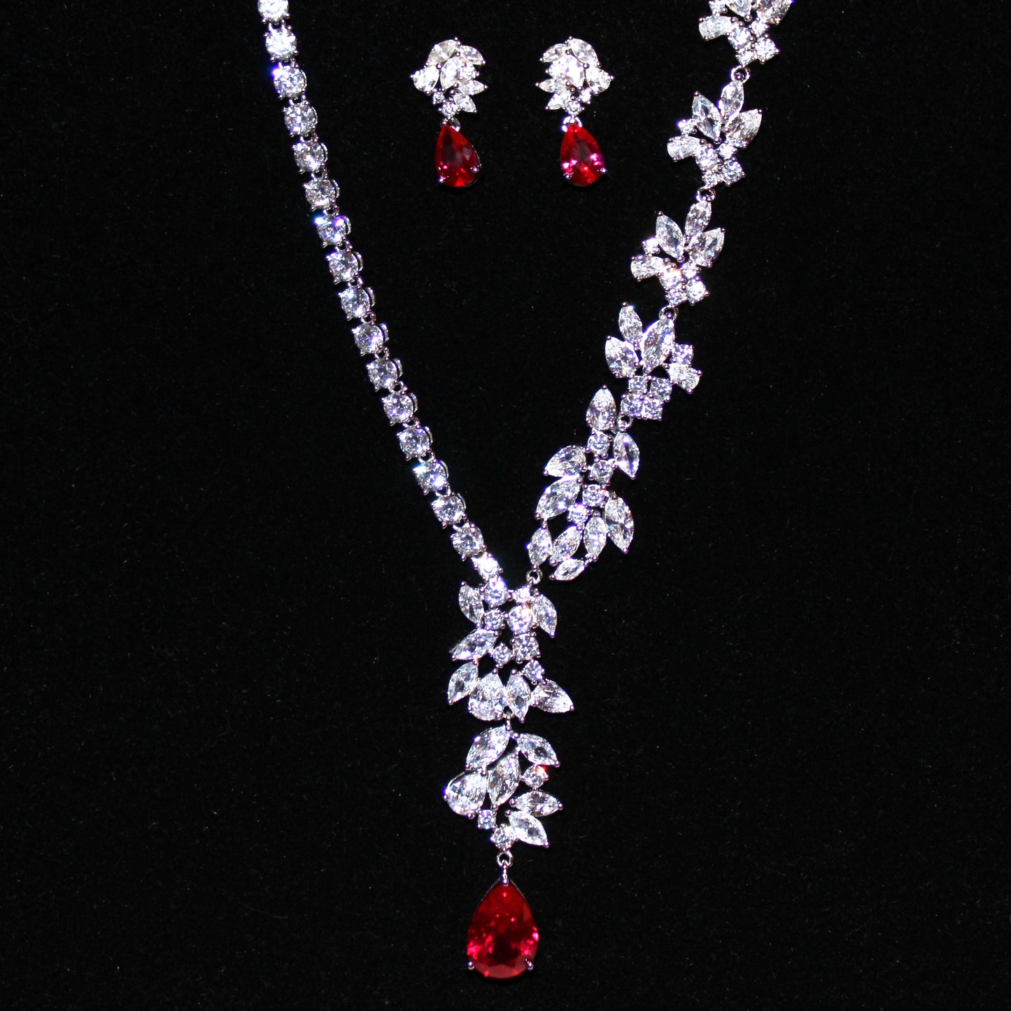 Theresa: Rhodium-plated .925 Sterling Marquise Diamond with teardrop Ruby Earrings