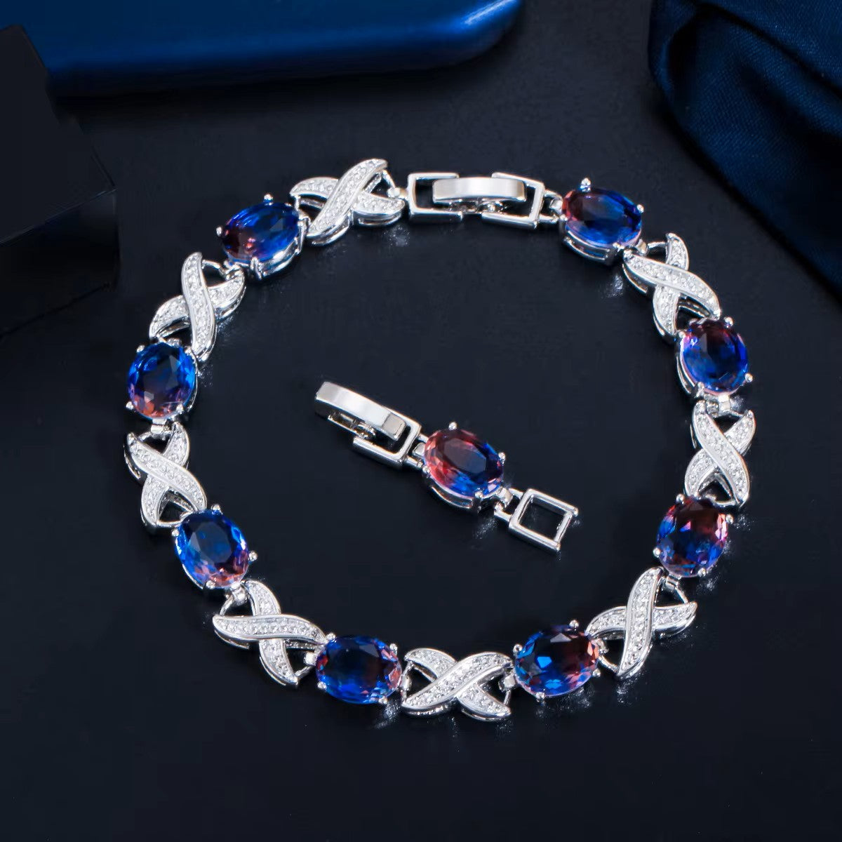Oval lab-created Mystic Topaz XOXO White Gold-Plated Link Bracelet