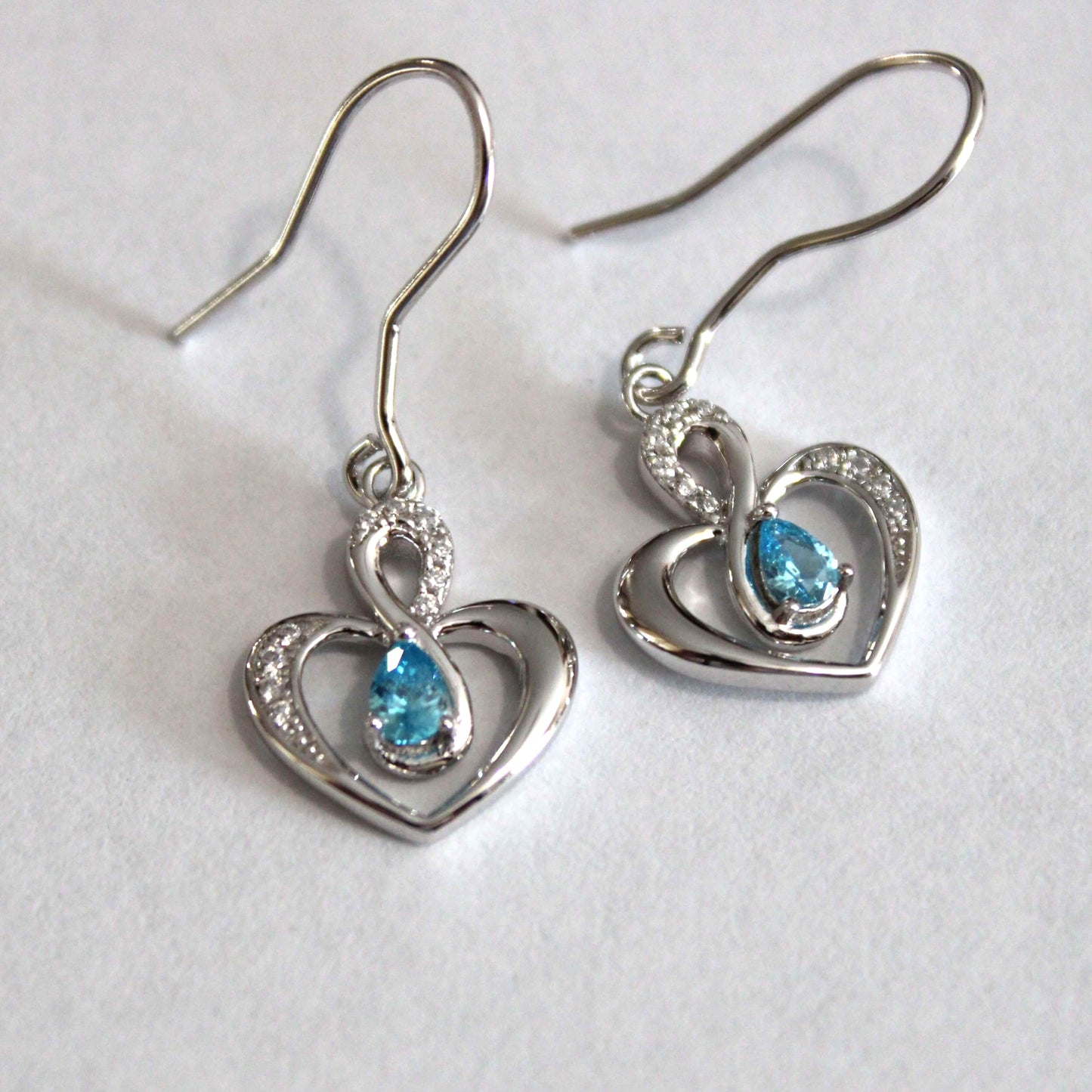 Elsie: Rhodium-plated .925 Sterling Blue Topaz Teardrop Heart Earrings