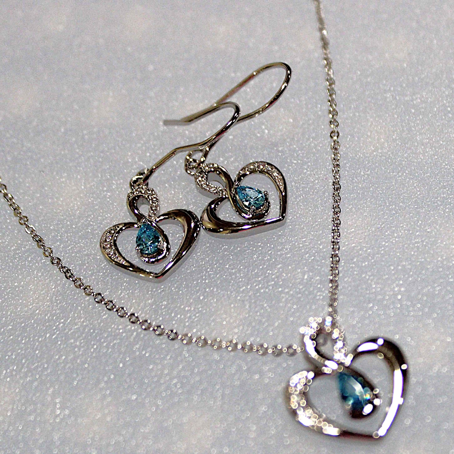 Elsie: Rhodium-plated .925 Sterling Blue Topaz Teardrop Heart Earrings