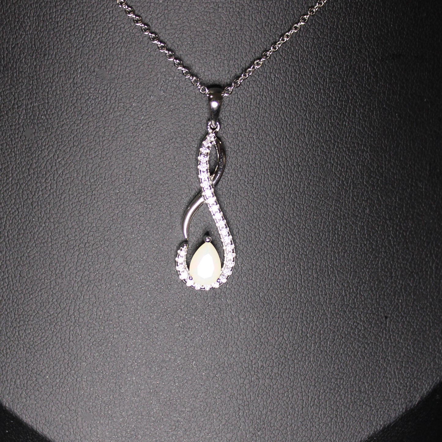 Shelby: Rhodium-plated .925 Sterling lab-created Opal Teardrop Infinity Necklace