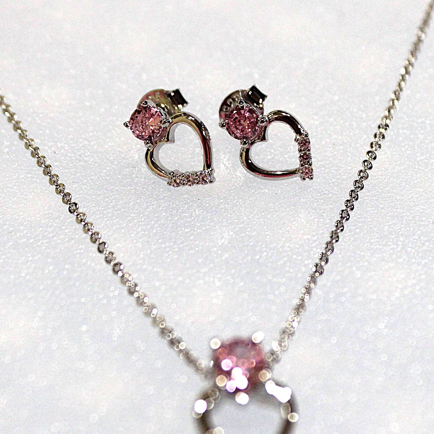 Zoey: Rhodium-plated .925 Sterling Heart Charm with lab-created Pink Sapphire Heart Drop Earrings