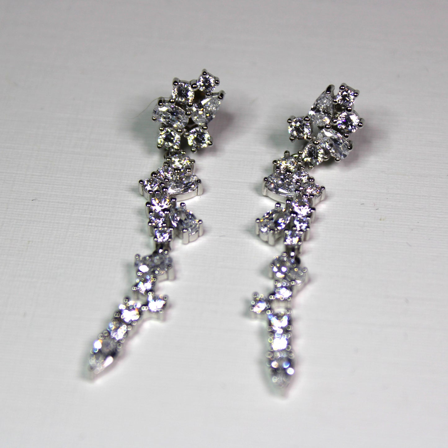 Angela: Rhodium-plated .925 Sterling lab-created Round and Pear Diamond Cluster Drop Set