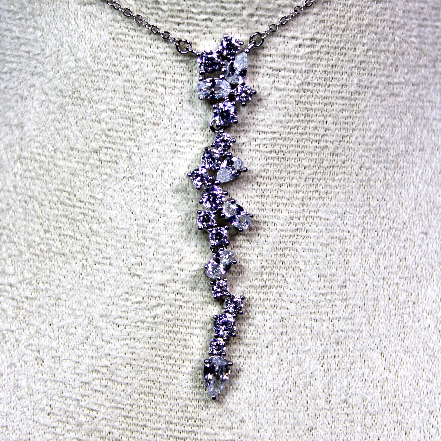 Angela: Rhodium-plated .925 Sterling lab-created Round and Pear Diamond Cluster Drop Set