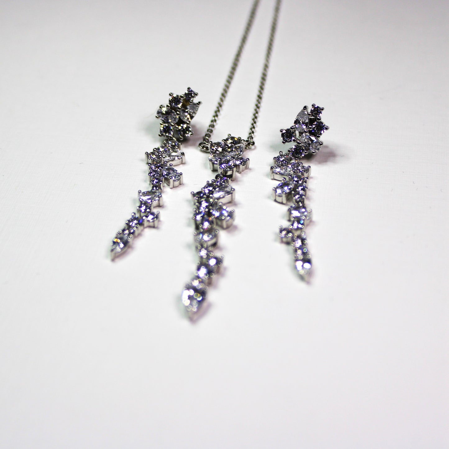 Angela: Rhodium-plated .925 Sterling lab-created Round and Pear Diamond Cluster Drop Set