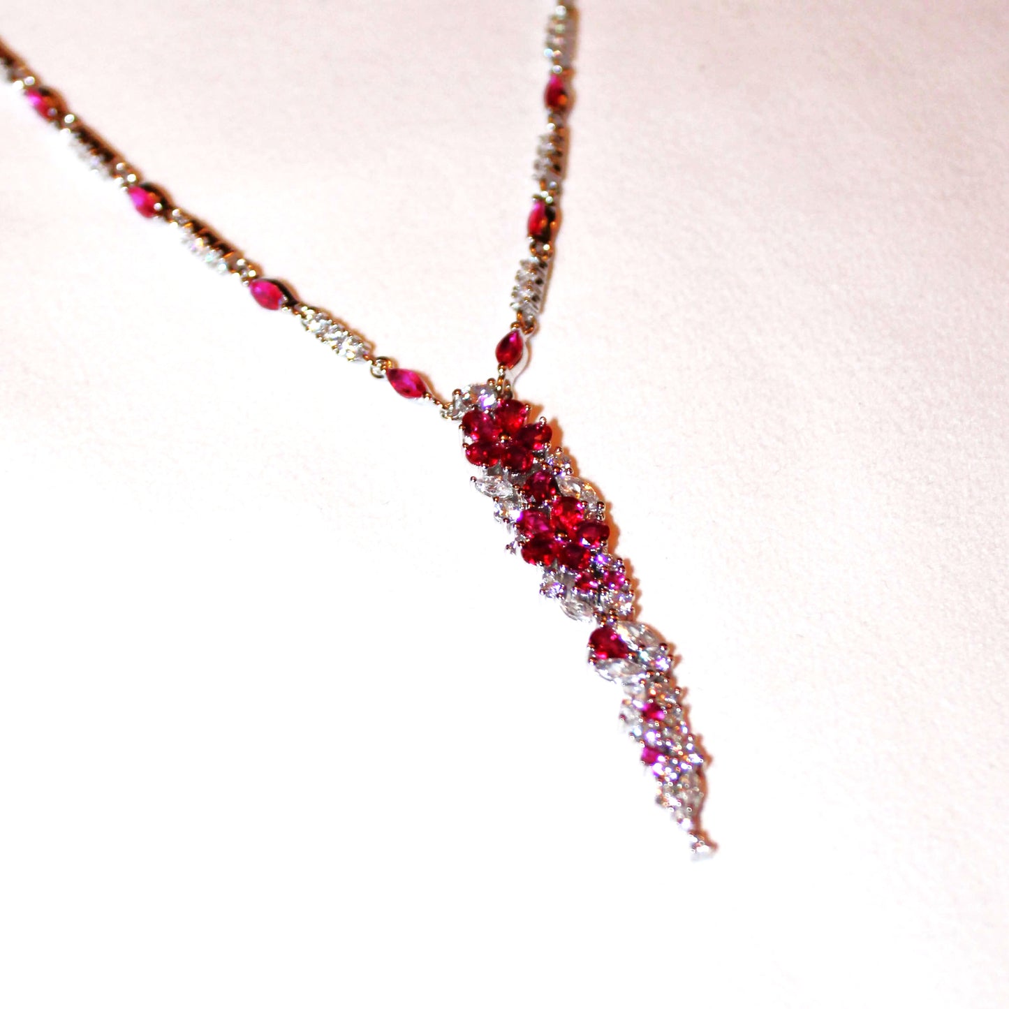 Cassandra: Rhodium-plated .925 Sterling Round Diamond and Teardrop Ruby Necklace and Earrings (Set)