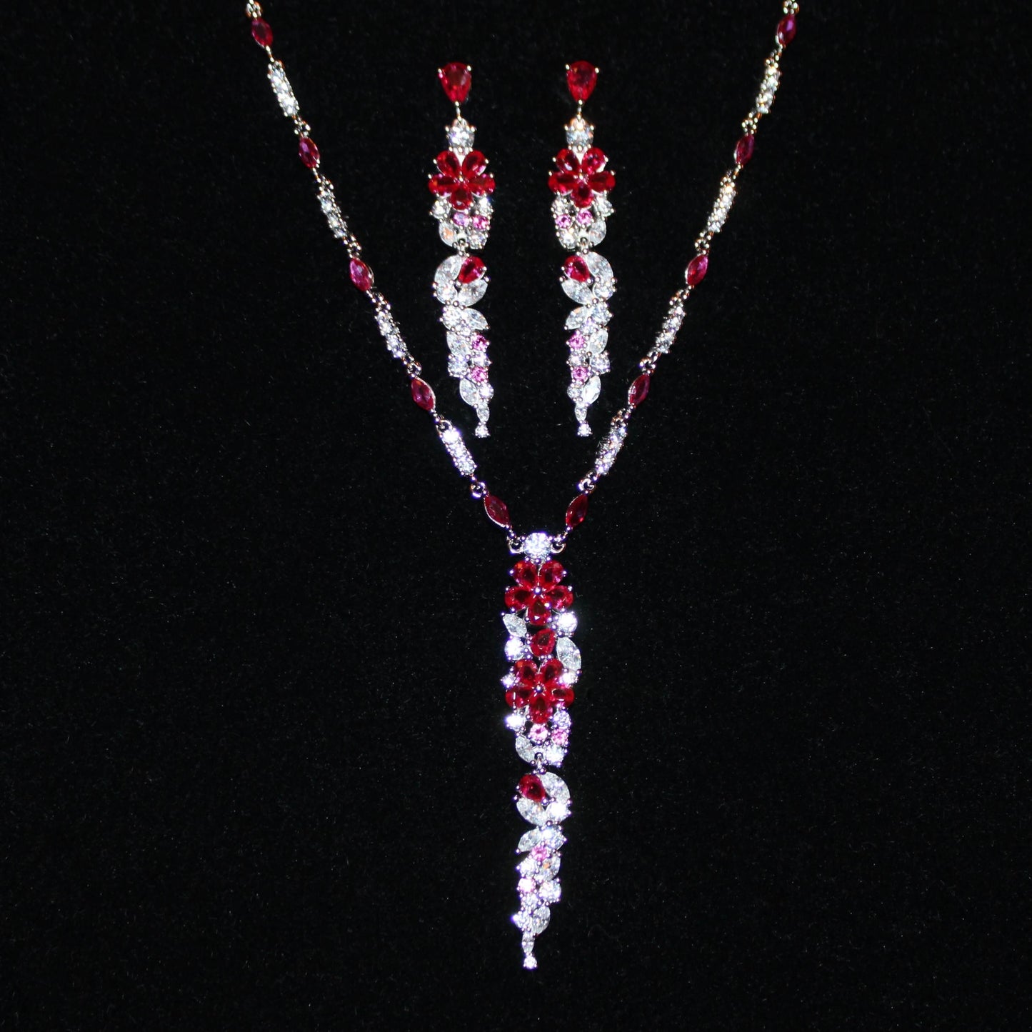 Cassandra: Rhodium-plated .925 Sterling Round Diamond and Teardrop Ruby Necklace and Earrings (Set)