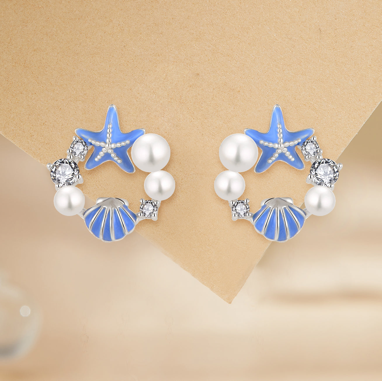 Rhodium-plated .925 Sterling Blue Enamaled Starfish and Shell with lab-created Gemstone Earrings