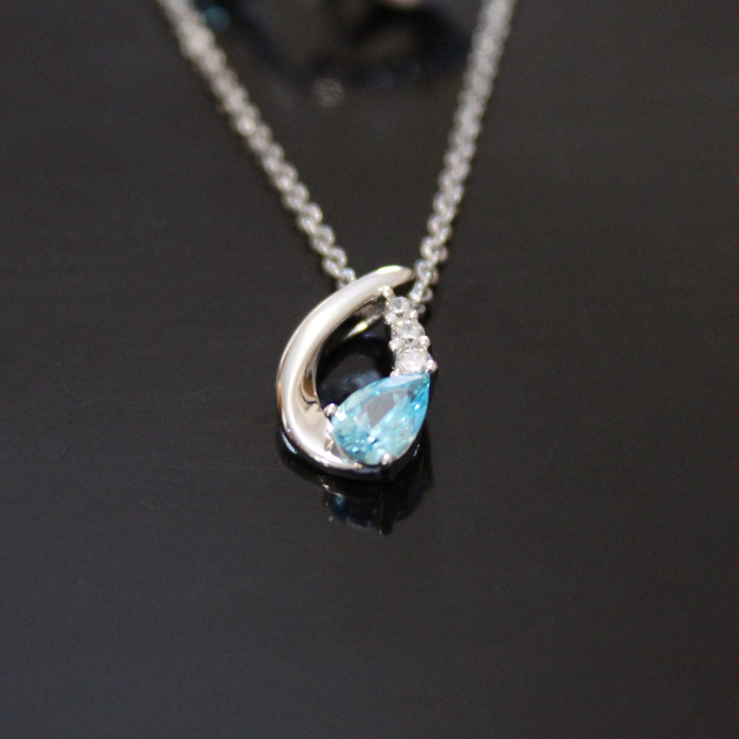 Nora: Rhodium-plated .925 Sterling Aquamarine Teardrop Earrings