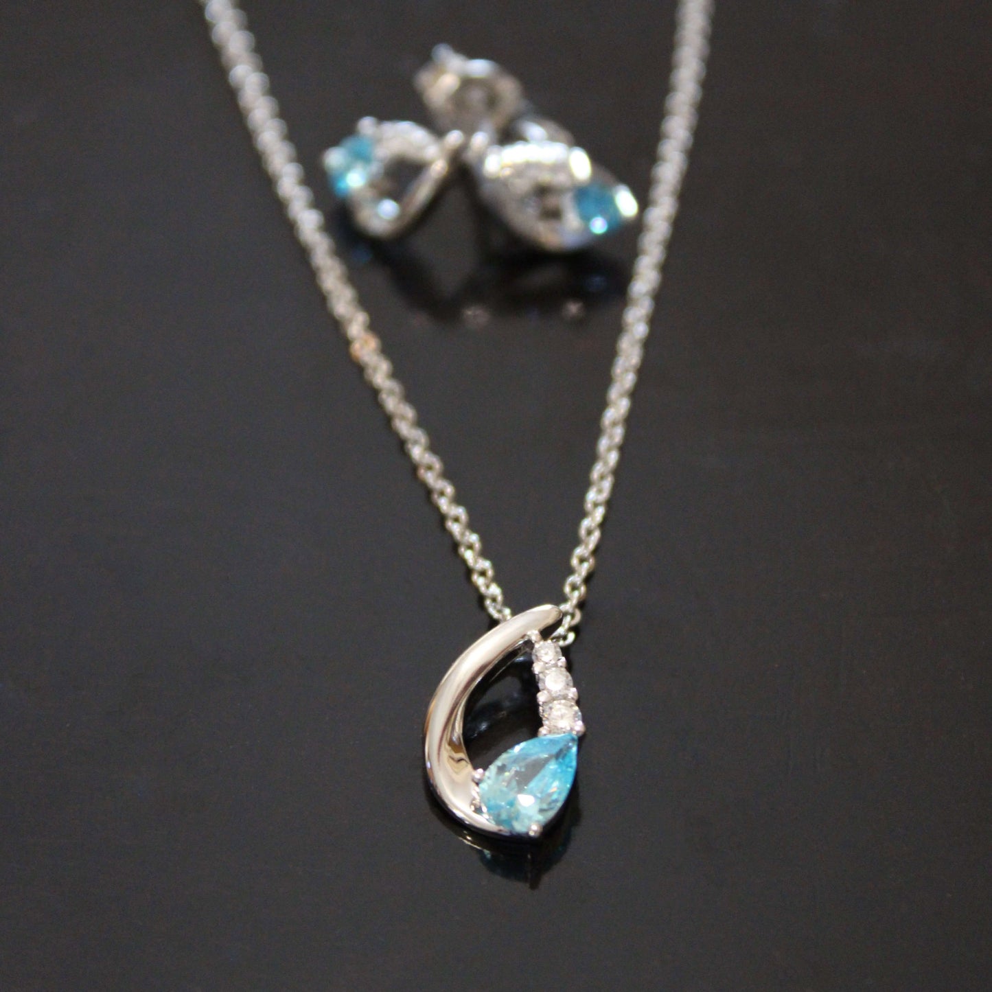 Nora: Rhodium-plated .925 Sterling Aquamarine Teardrop Earrings