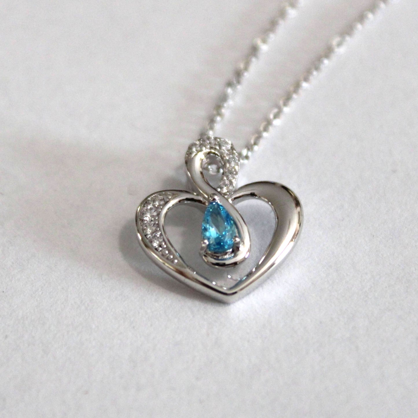 Elsie: Rhodium-plated .925 Sterling Blue Topaz Teardrop Heart Necklace