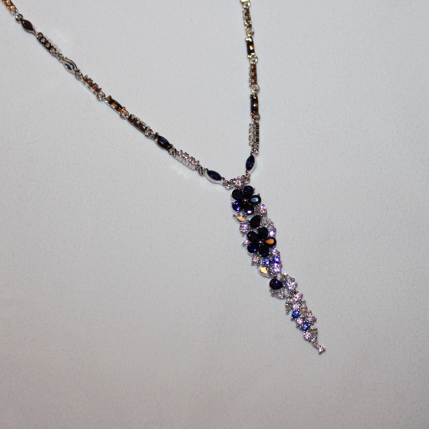 Kathryn: Rhodium-plated .925 Sterling lab-created Diamond and Sapphire Necklace and Earrings Set