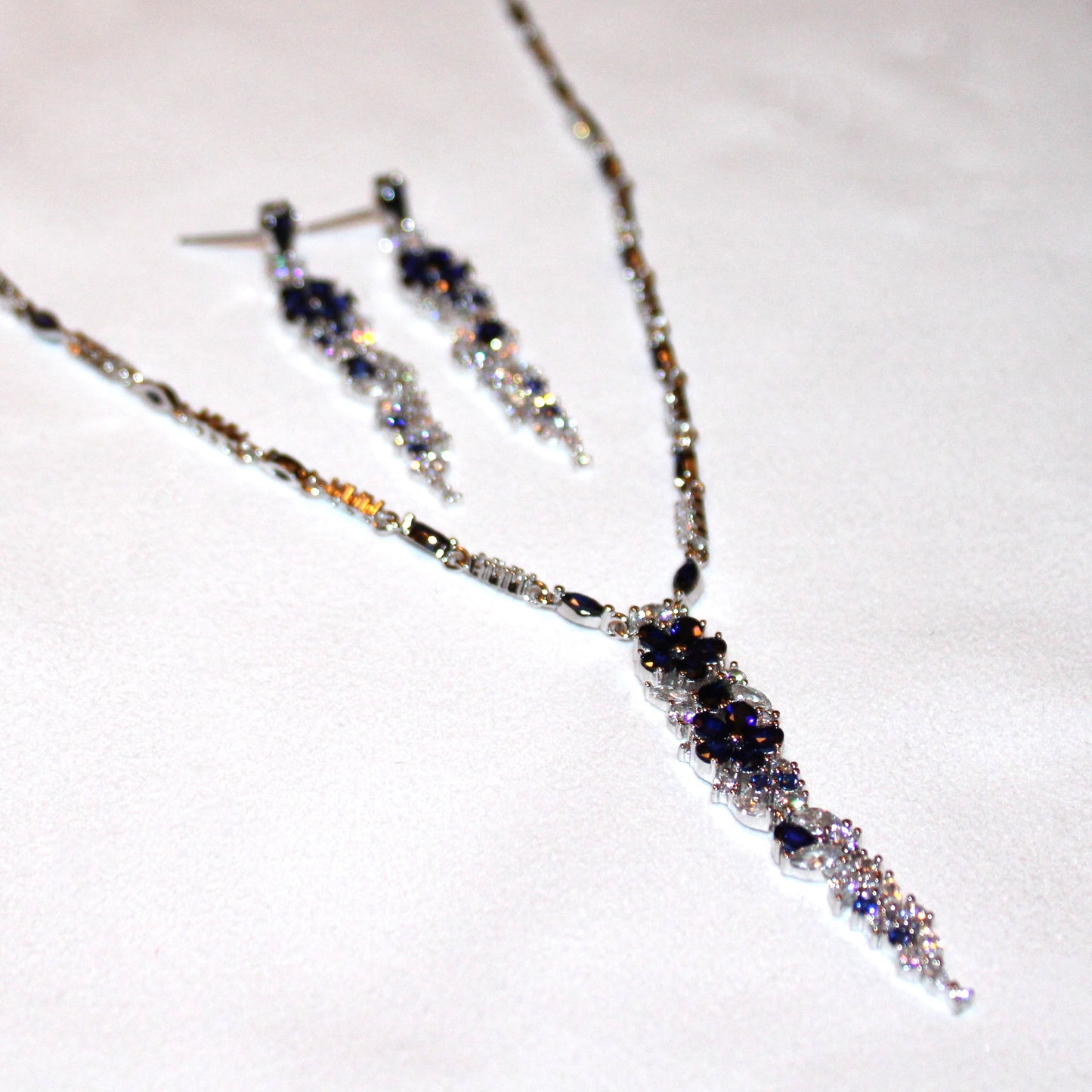 Kathryn: Rhodium-plated .925 Sterling lab-created Diamond and Sapphire Necklace and Earrings Set