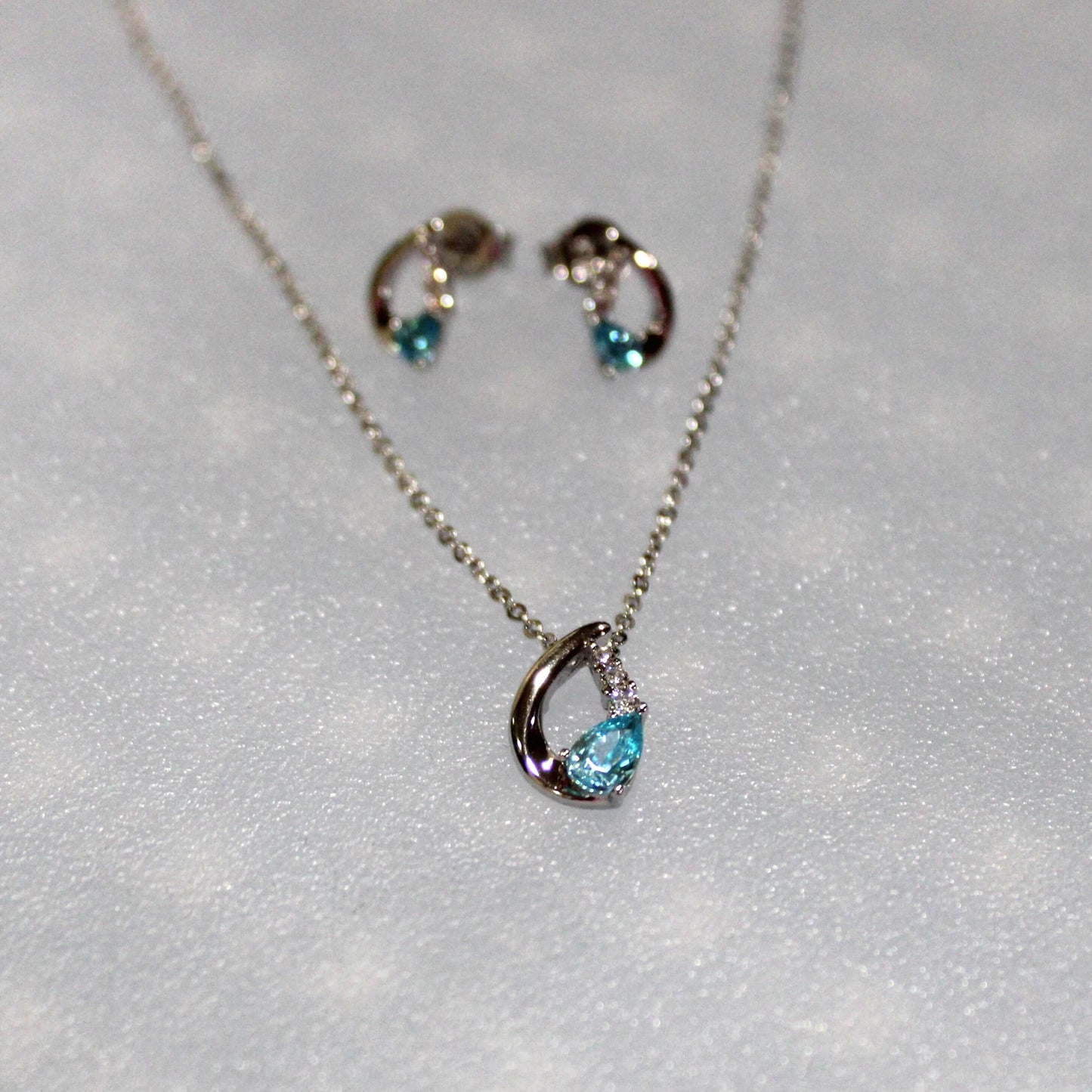 Nora: Rhodium-plated .925 Sterling Aquamarine Teardrop Earrings