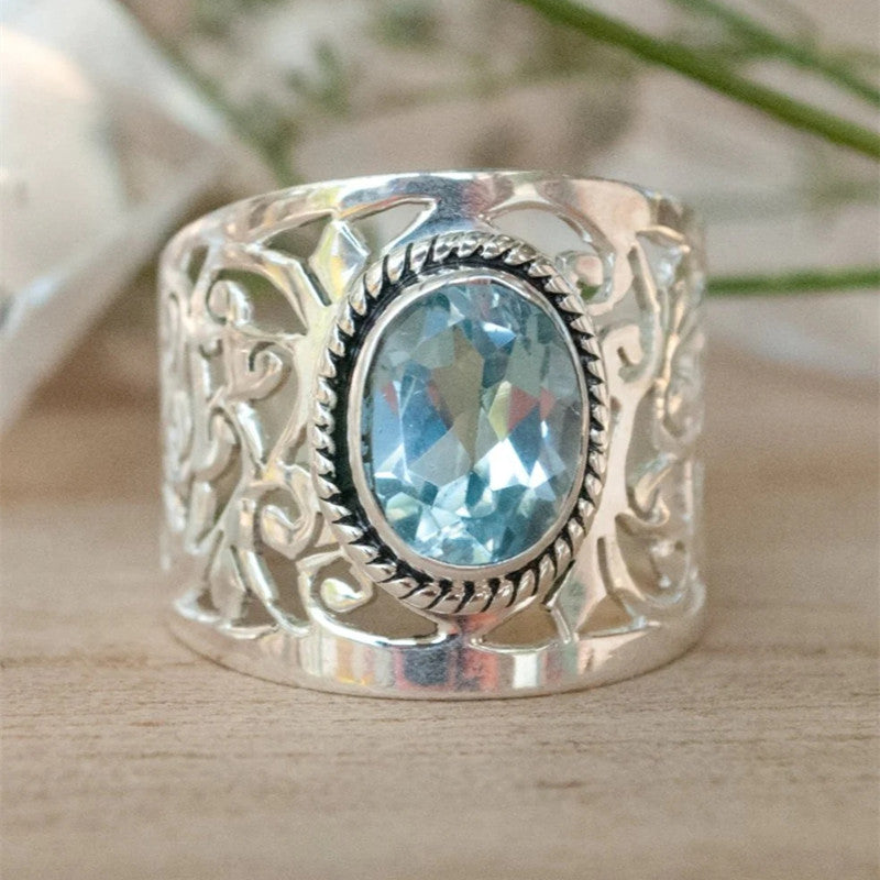 Silver Plated Band Ring with Oval Blue Topaz Cubic Zirconia