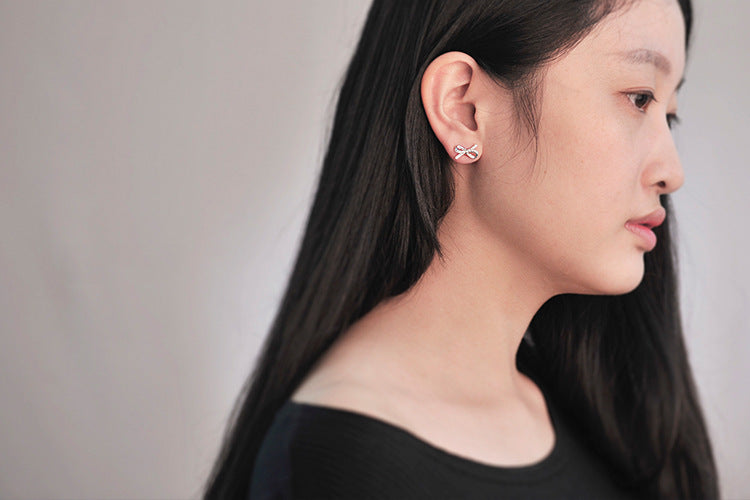.925 Sterling Pave Bow Stud Earrings