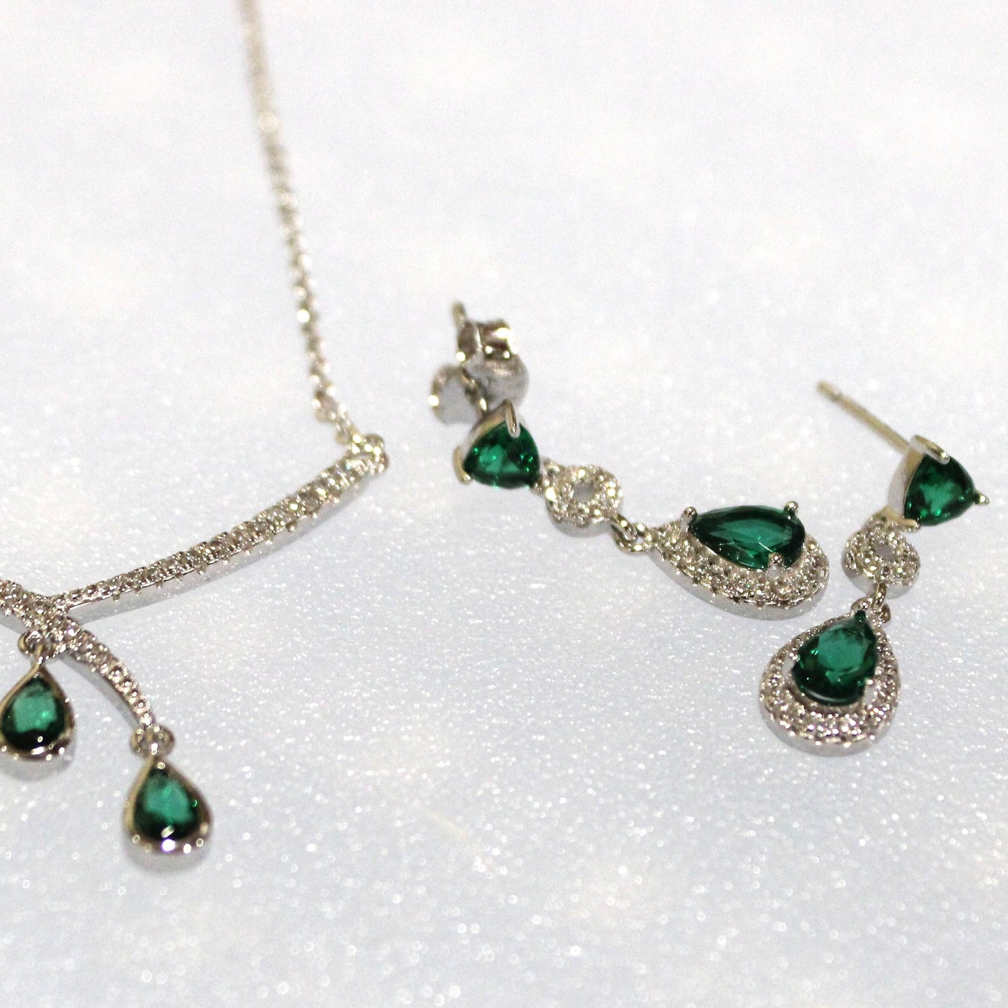 Aurora: Rhodium-plated .925 Sterling lab-created Emerald Teardrop and Diamond Earrings