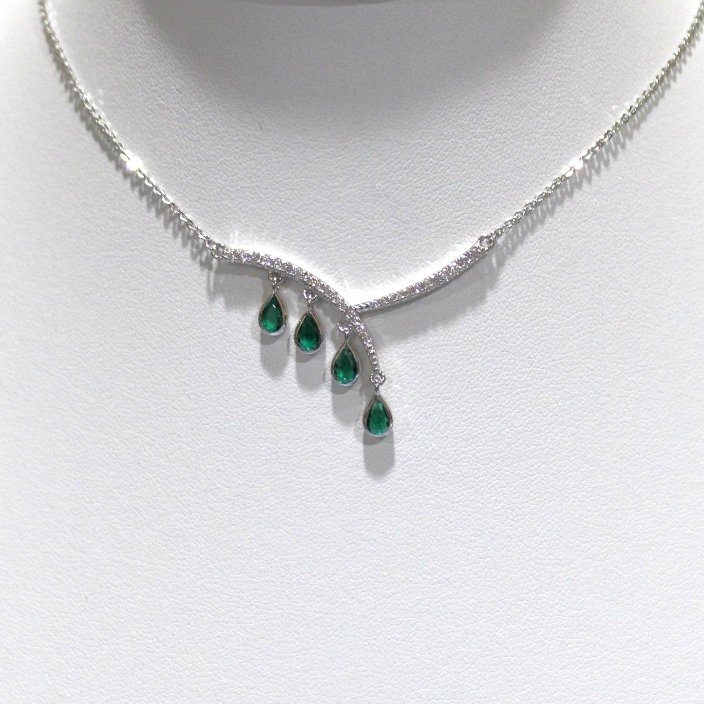 Aurora: Rhodium-plated .925 Sterling lab-created Emerald Teardrop and Diamond Earrings