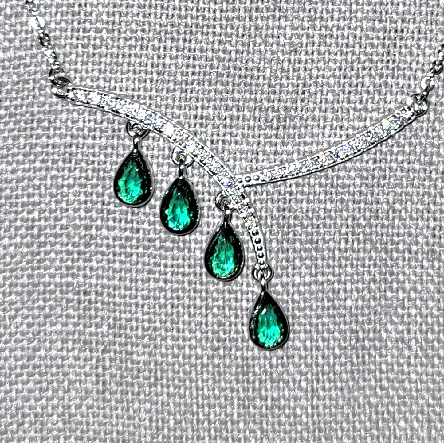 Aurora: Rhodium-plated .925 Sterling lab-created Emerald Teardrop and Diamond Earrings