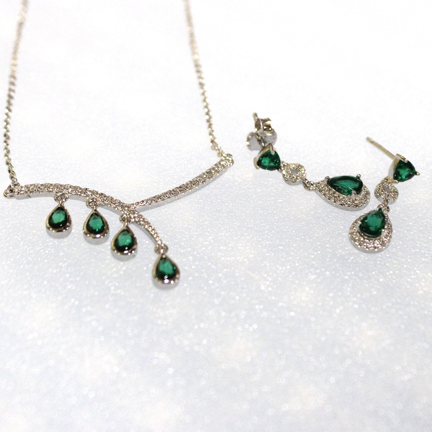 Aurora: Rhodium-plated .925 Sterling lab-created Emerald Teardrop and Diamond Earrings