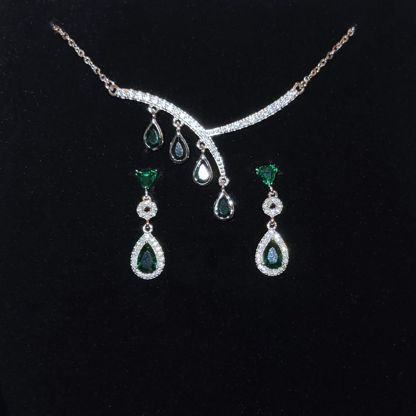 Aurora: Rhodium-plated .925 Sterling lab-created Emerald Teardrop and Diamond Earrings