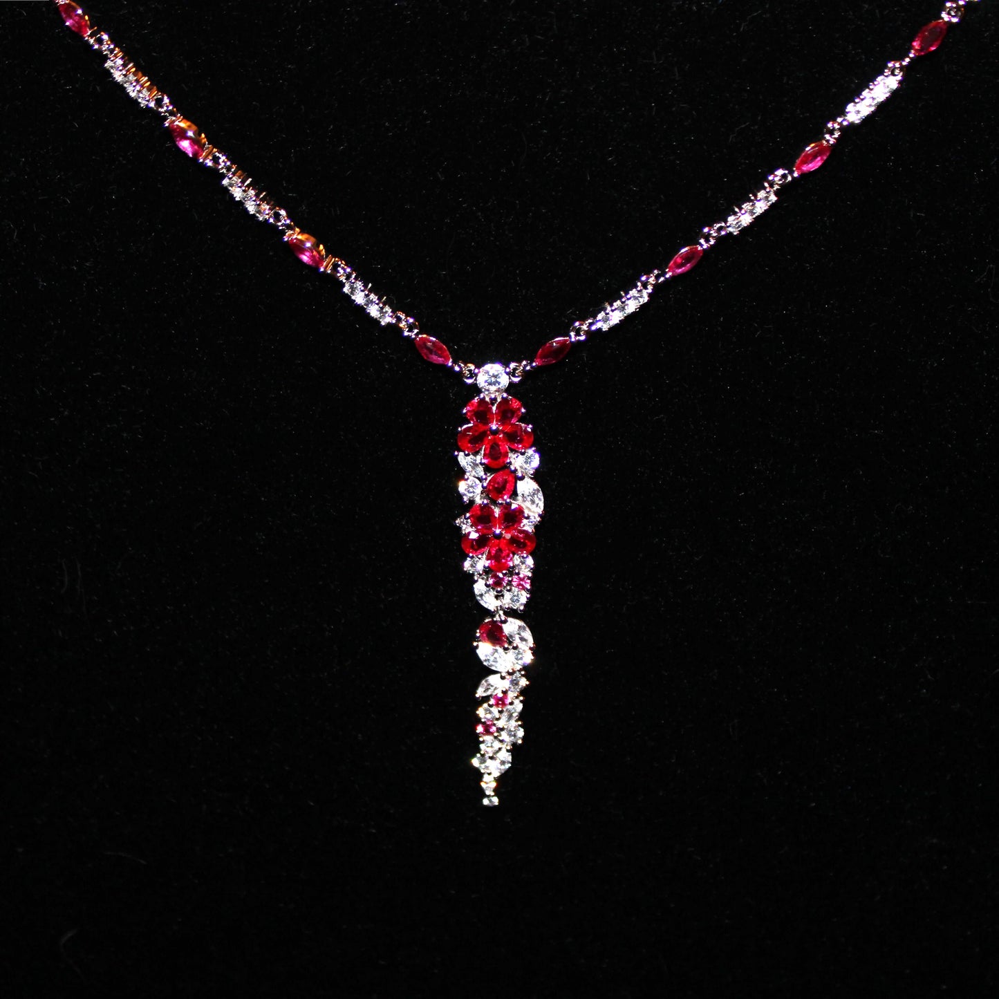 Cassandra: Rhodium-plated .925 Sterling Round Diamond and Teardrop Ruby Necklace and Earrings (Set)