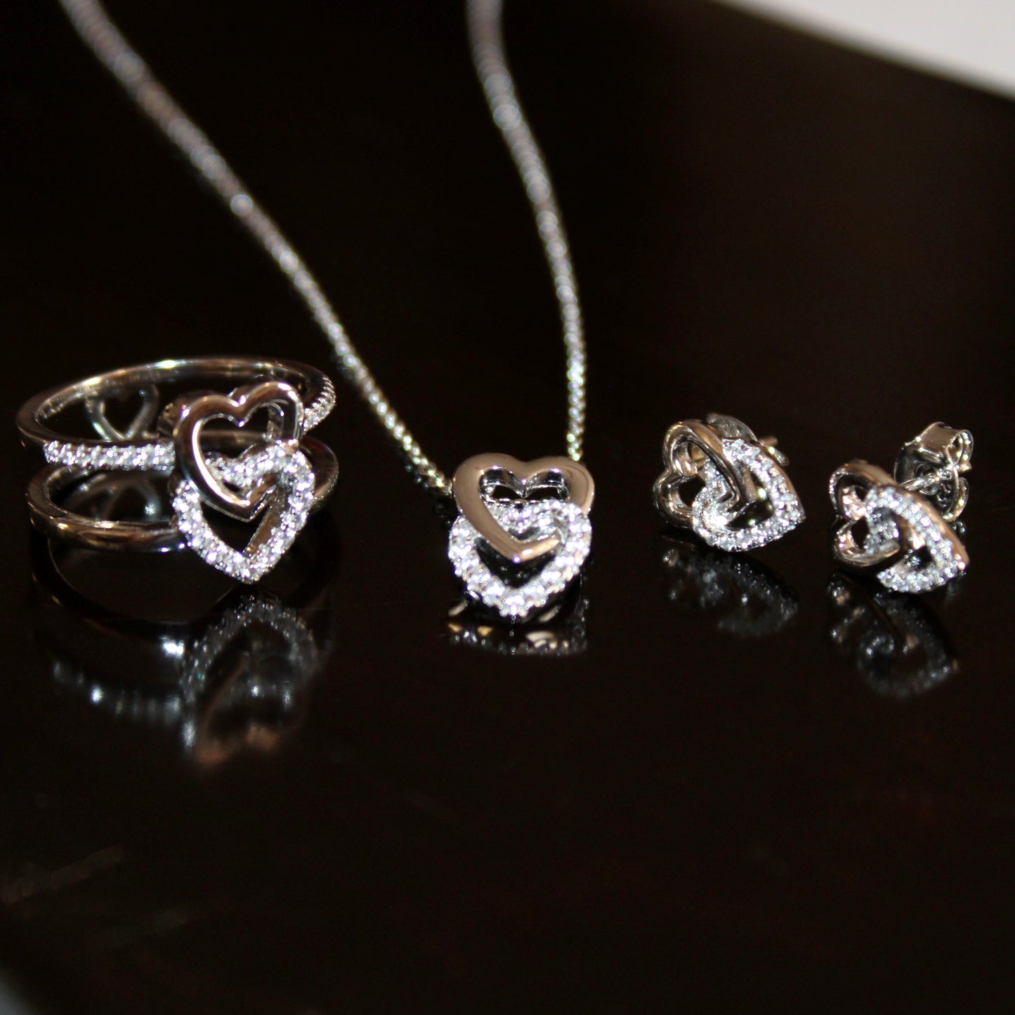 Miranda:  Rhodium-plated .925 Sterling lab-created Pave Diamond Double Heart Earrings